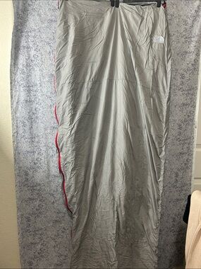The North Face Light Gray Sleeping Bag with Red